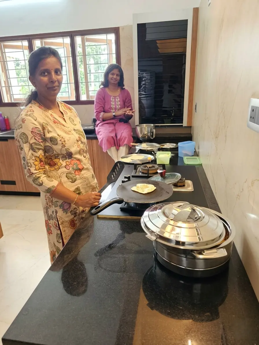 Savitha and Vinitha working together on recipes for the Coriander Chefs blog